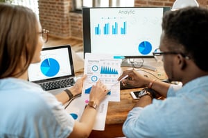 coworkers-working-together-with-analytics-2025-03-13-03-08-55-utc