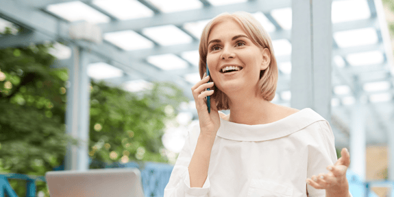 smiling woman talking on cellphone