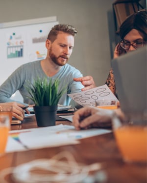 man talking to someone during brainstorm session